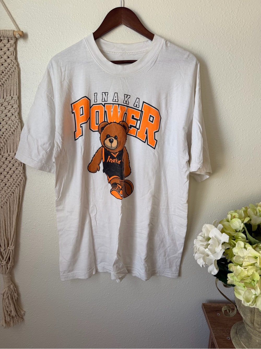 Inaka Power White Tee with Orange Bear Graphic
